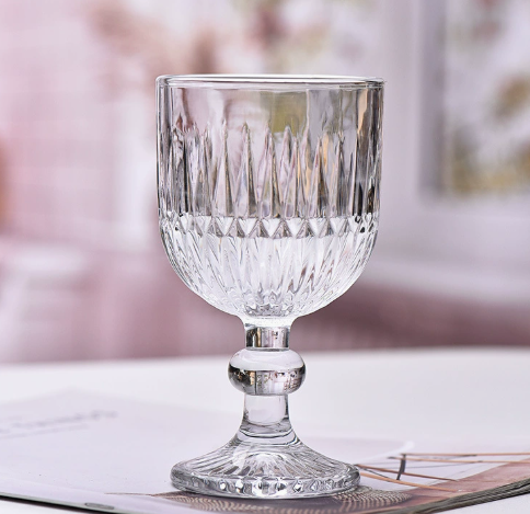 Vintage Embossed Glass Goblet with Elegant Stemmed Base